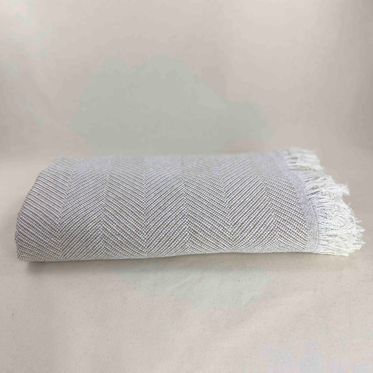 Multipurpose bedspread for sofa or bed with fringes. Beige and Ecru color.