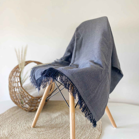 Multipurpose summer quilt for sofa or bed. Dark gray color.