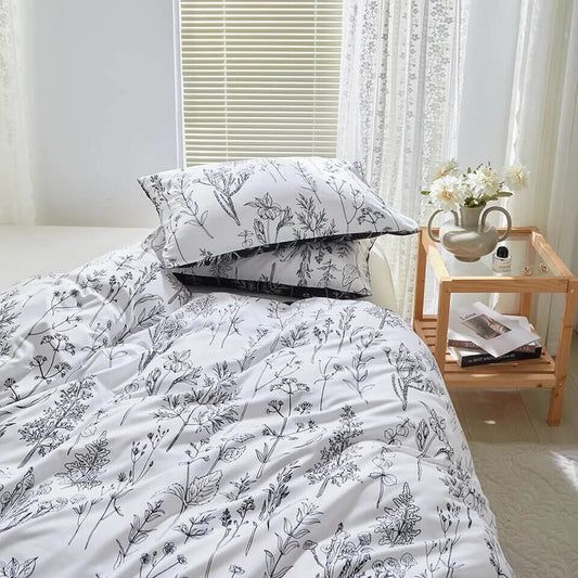 Printed duvet cover with black leaves and pale pink background, extra soft microfiber.