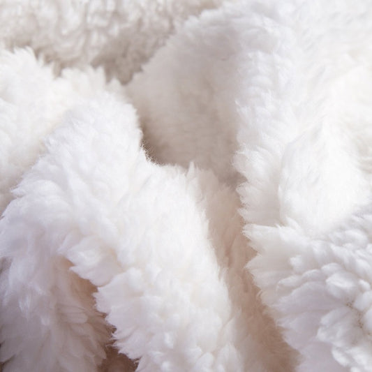 Fleece and extra soft reversible blanket. Light beige colour.